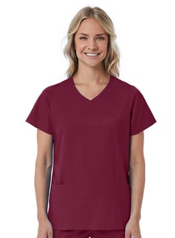 A red women's mock wrap top featuring short sleeves and two front pockets. The model is smiling at the camera.