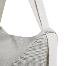 A multi-purpose bag in white with a textured surface and a sturdy strap, featuring a logo.