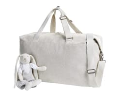 A light grey duffle bag sits beside a soft toy rabbit wearing a shirt and shorts. The bag has a shoulder strap and logo.