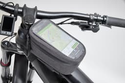 A grey bicycle frame bag mounted on the handlebars, featuring a transparent touchscreen compartment for a smartphone.