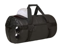 A black duffle bag rests on a surface, topped with a grey cap and a pair of sunglasses hanging from its side.