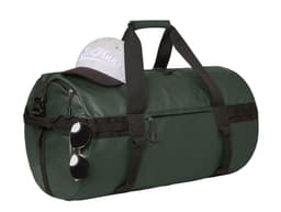A green duffle bag sits with a grey cap and sunglasses resting on top, featuring a logo.
