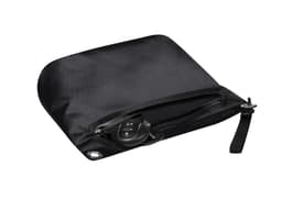 A black dry bag features a zippered closure and a wrist strap, with a set of keys placed inside.