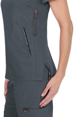 A dark grey top with pockets and zippers, featuring a fitted design and a logo on the side.