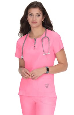 A healthcare top in vibrant pink, featuring a zippered neckline and a pocket, worn by a model with a stethoscope.
