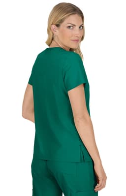 A woman wearing a teal Becca Top, showcasing the back view. The top has short sleeves and a relaxed fit.