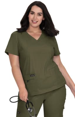 A woman wearing a v-neck olive green medical scrubs top with two pockets, holding a stethoscope.