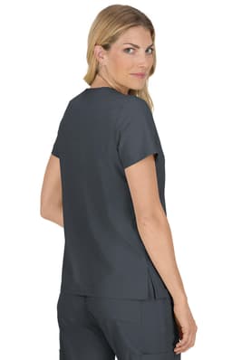 A woman wearing a dark grey top with short sleeves, viewed from the back, featuring a split hem design.