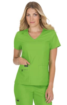 A medical scrubs top in bright green, featuring a V-neck and two front pockets, worn by a model.