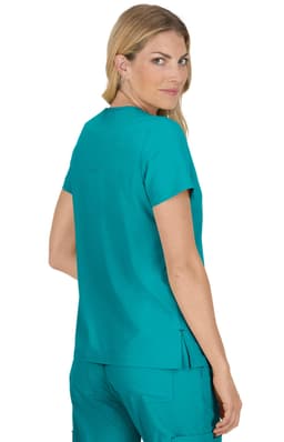 A woman wearing a teal medical top, shown from the back, featuring a loose fit and short sleeves.
