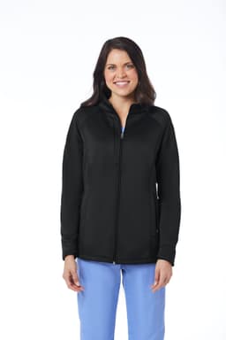A woman wearing a black fleece jacket with a zip front, featuring a logo on the chest.