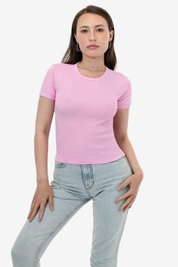 A pink fitted t-shirt displayed on a model, paired with light denim jeans. The shirt has a small logo.