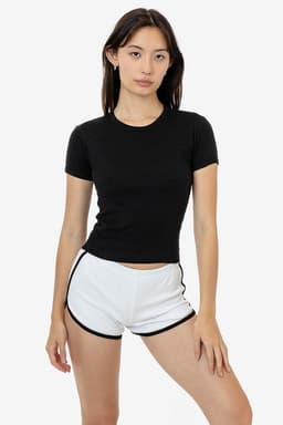 A black short-sleeved t-shirt displayed on a model paired with white shorts. The shirt features a logo.