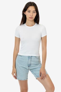 A white fitted t-shirt with short sleeves, displayed on a model wearing denim shorts. The product includes a logo.