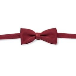 A burgundy bow tie with a smooth finish and adjustable strap. It features a logo on the label.
