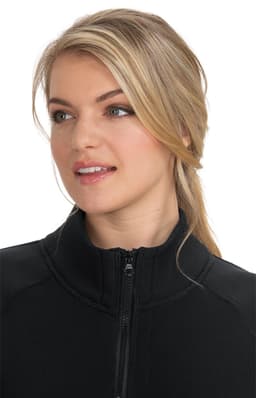 A wellness jacket in black, featuring a zip-up front and a high neckline, worn by a woman with long blonde hair.