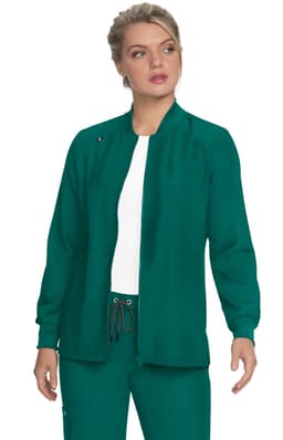 A green jacket with a high collar and long sleeves, featuring a logo. The model wears it over a white top.