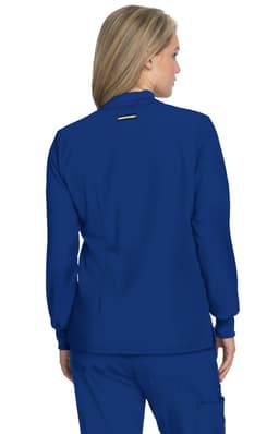 A blue jacket with long sleeves, featuring a back detail and a logo. Designed for active wear.