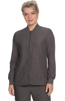 A woman wearing a grey jacket with a collar and front zip, featuring a logo on the left side.
