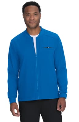 A blue jacket with a zip and a logo, worn by a man standing against a plain background.