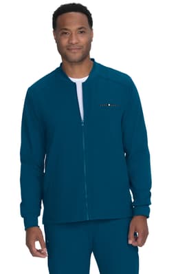 A teal jacket with a zip closure, featuring a logo, worn by a smiling model.