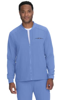 A man wearing a light blue jacket with a zip and one unobtrusive logo on the chest.