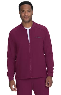 A maroon jacket with a zipped front and a logo, worn by a smiling model.