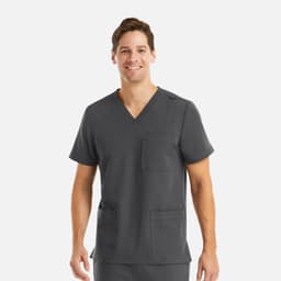 A men's v-neck top in grey featuring three pockets and a logo. The model is smiling while wearing the top.
