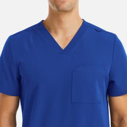 A blue V-neck top featuring three pockets, with a logo on the fabric.