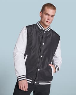 A black and white California Jacket featuring a button-up front and striped cuffs, worn by a model.