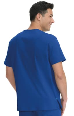 A blue short-sleeved top worn by a man, featuring a simple design and a round neckline. The top has a logo.