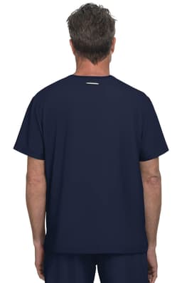 A navy blue t-shirt is displayed, featuring a simple design and a logo on the back. The model is facing away.
