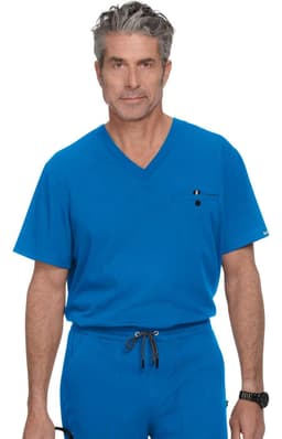 A man wearing a bright blue v-neck scrub top with a pocket, paired with matching blue scrub pants.