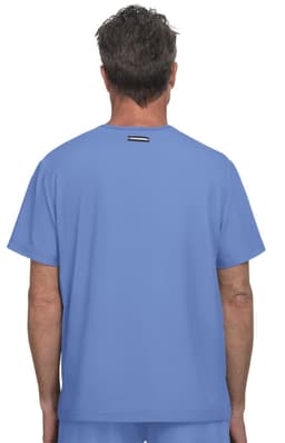 A blue medical scrub top viewed from the back, featuring a simple design and a logo on the back neckline.