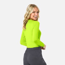 A vibrant green long-sleeve women's underscrub tee with a fitted design, displayed from the back.