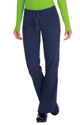 Navy blue pants with pockets, featuring a drawstring waist and worn by a model in a green top.