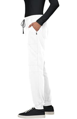 A pair of white jogger pants with a drawstring waistband, featured alongside a black long-sleeve top and black shoes.