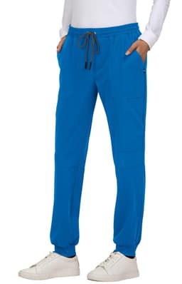 A pair of bright blue jogger pants with a drawstring waist and side pockets, worn with white shoes.