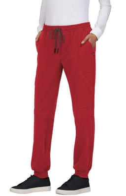 A pair of red jogger pants with an elastic waistband, drawstring, and side pockets, featuring a logo.