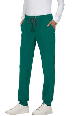 A pair of teal jogger pants with an elastic waistband and side pockets. Features a logo on the garment.