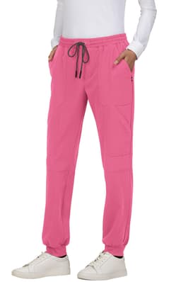 A pair of pink jogger pants with an elasticated waist and side pockets, featuring a drawstring and a logo.