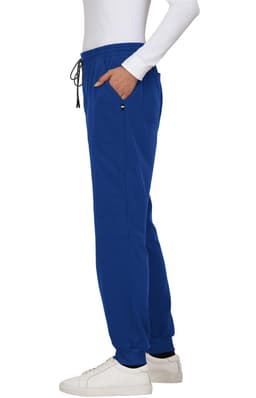 A pair of blue jogger pants with an elastic waistband and pockets, featured on a model.