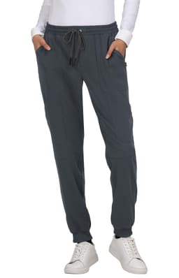 A pair of grey jogger pants with a drawstring waist and side pockets, worn with a white long-sleeve top.