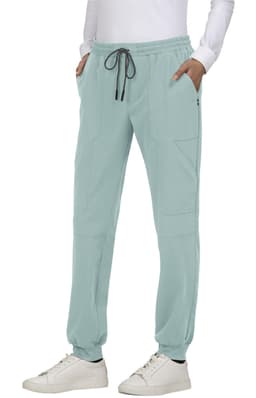 A pair of light blue jogger pants with pockets and a drawstring waist, paired with white sneakers.