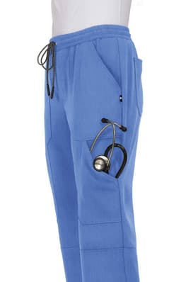 A pair of blue jogger pants with pockets, featuring a stethoscope hanging from one side. The pants have a logo.