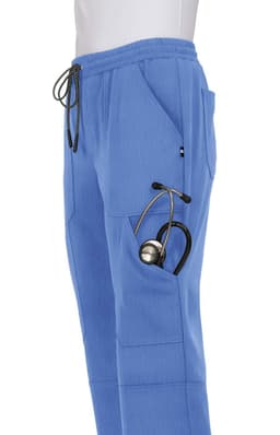 A pair of blue jogger pants featuring pockets, with a stethoscope tucked in one pocket.