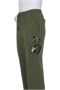 A pair of olive green jogger pants with a side pocket holding a stethoscope. Features an elastic waistband.