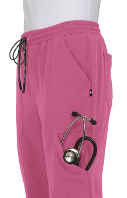 A pair of pink jogger pants with pockets, featuring a stethoscope tucked into one of the side pockets.