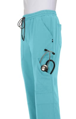 A pair of turquoise jogger pants with pockets, featuring a stethoscope tucked into one pocket.