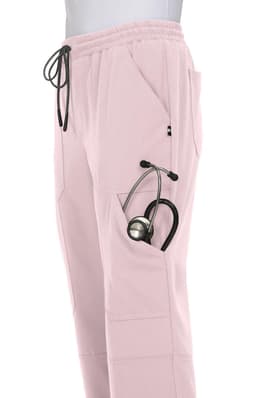 A pair of light pink jogger pants with pockets, featuring a stethoscope tucked into one of the pockets.